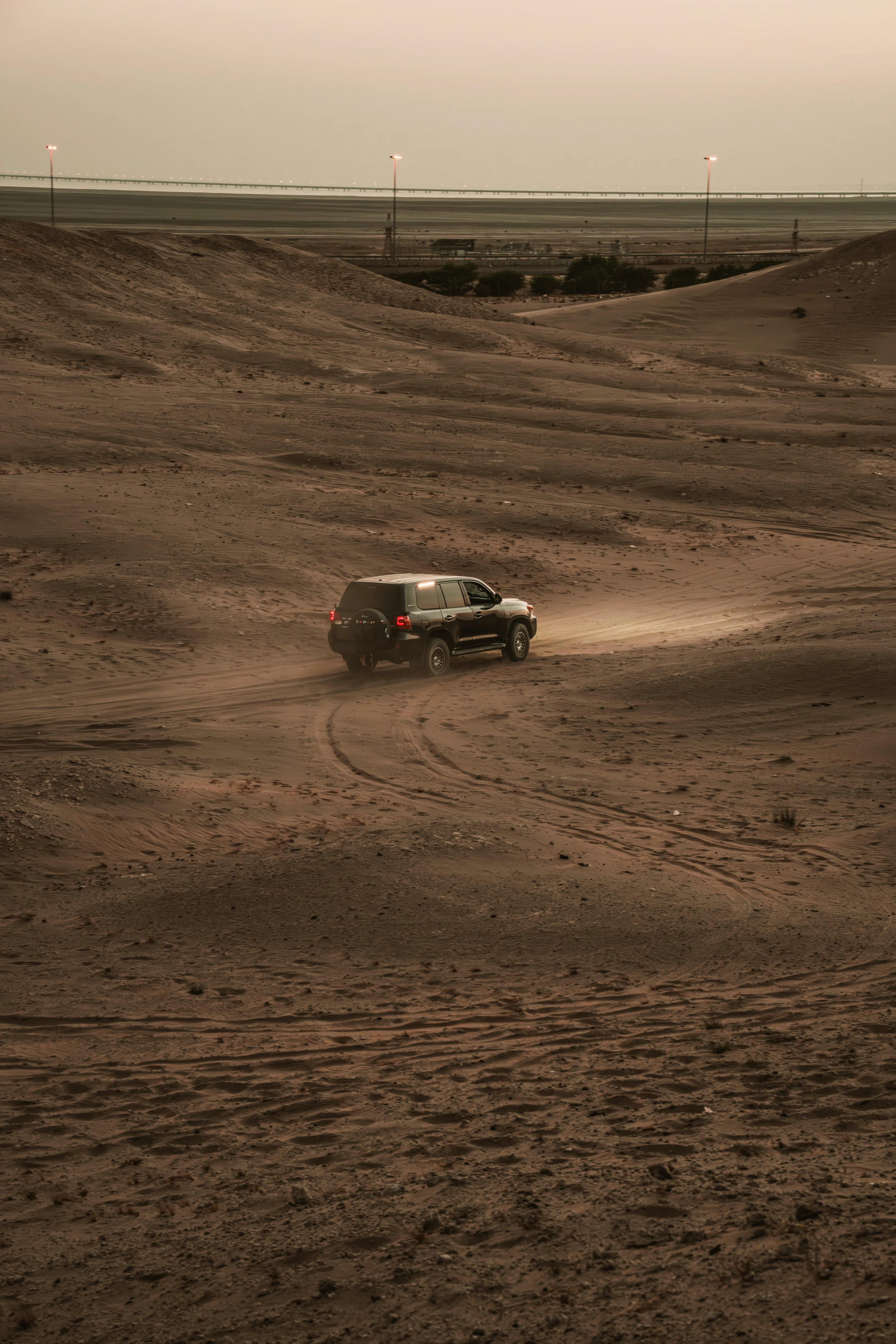 Vehicle crossing a desert basin